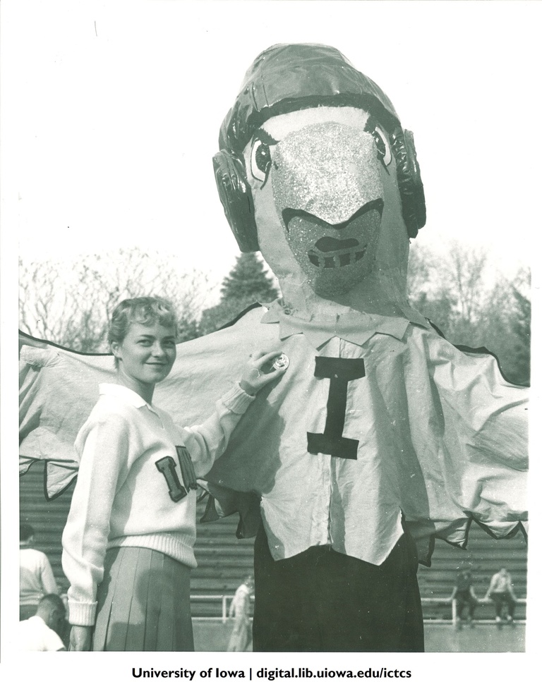 Herky getting homecoming pin, The University of Iowa, November 3, 1956